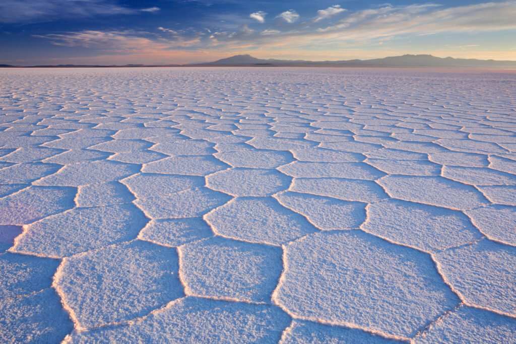 Hexagonal salt patterns at Salar de Uyuni, Bolivia, at sunrise — hero image for "Why the Data Layer Got Outsourced — and Stayed There,"